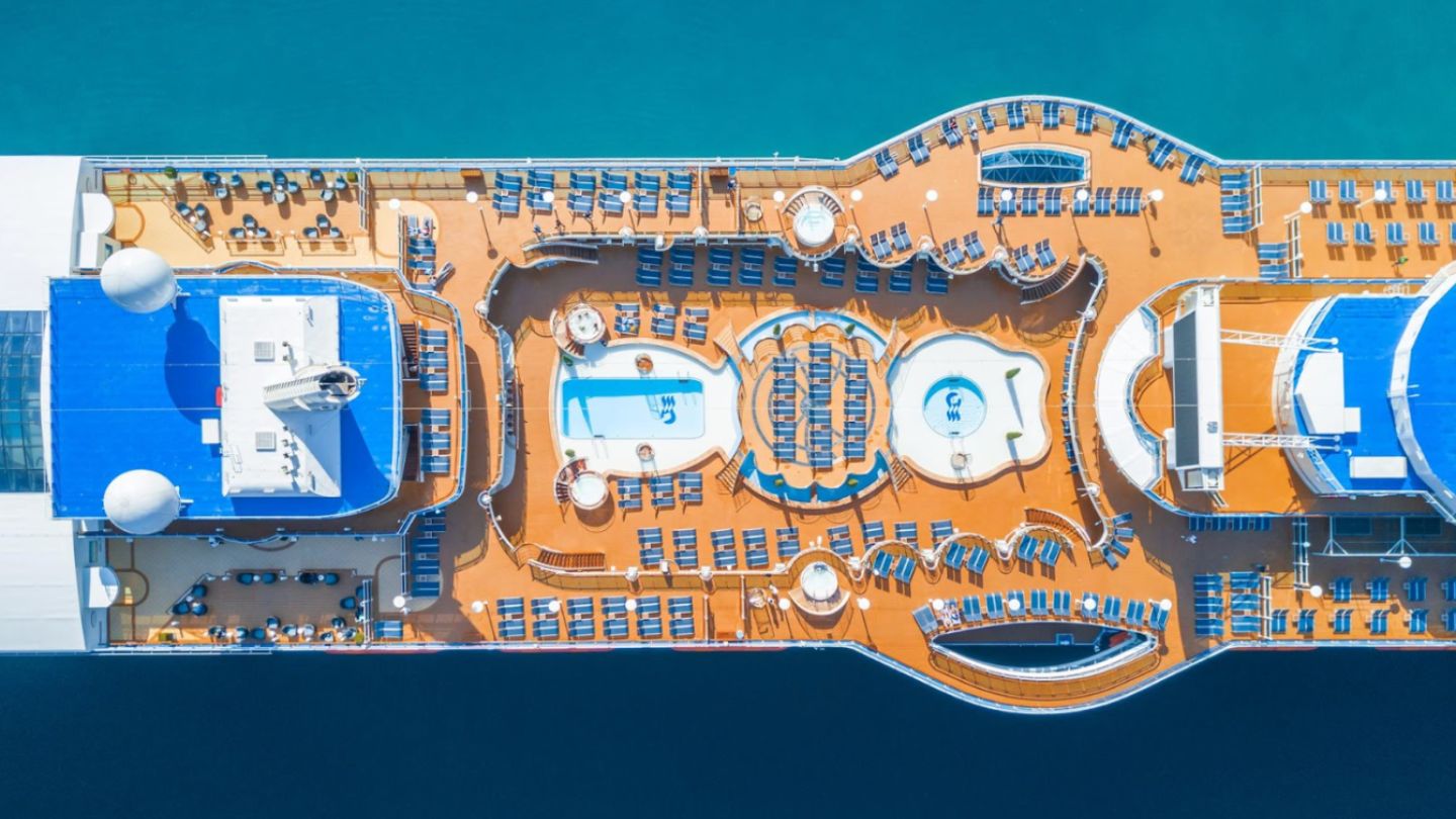Aerial perspective of a cruise ship navigating the ocean, showcasing options for ocean cruise planning.