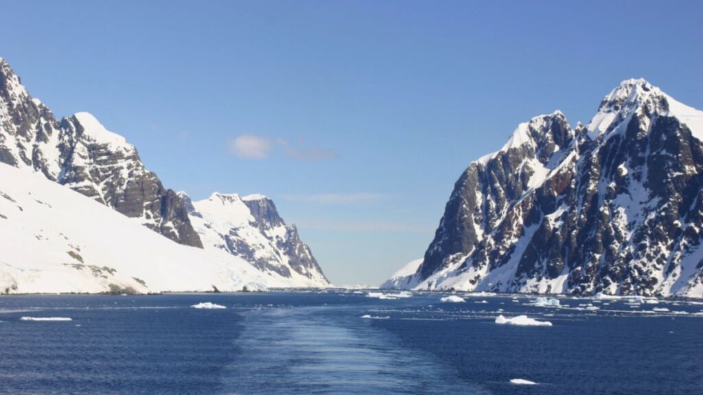A scenic view of the ocean from a boat on an Antarctica expedition, highlighting the vast, icy expanse and serene atmosphere.