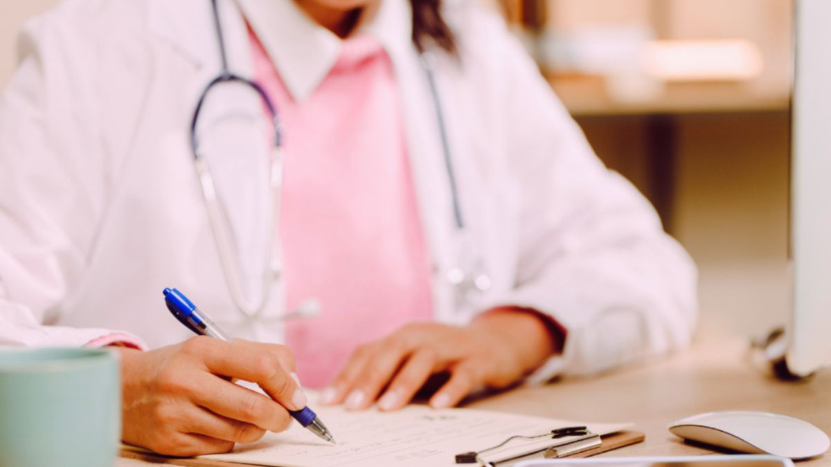 A doctor writes a prescription for medications of a person going on an ocean cruise adventure.