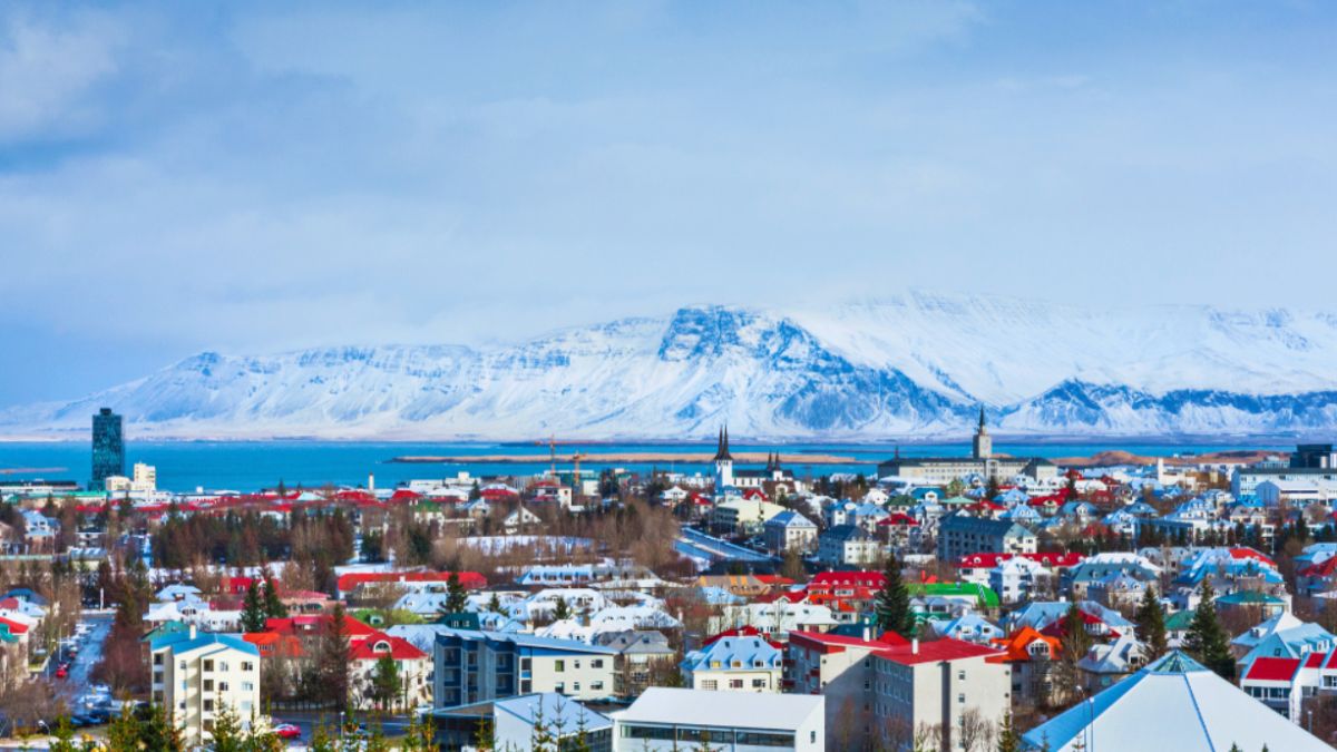 Corporate Event Retreats Abroad:<br>Top 10 International Destinations 2 A panoramic view of Reykjavik, Iceland, showcasing its vibrant cityscape, ideal for corporate event retreats.