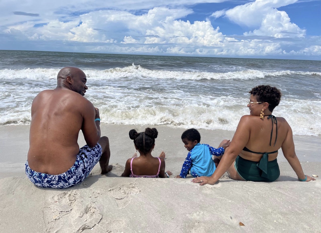 Julie Augusto with her family on the beach