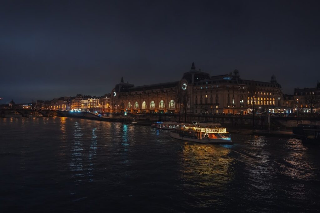 A river cruise ship lit up at night during the European Christmas market season