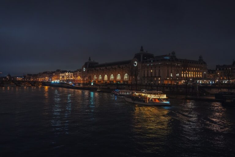 A river cruise ship lit up at night during the European Christmas market season