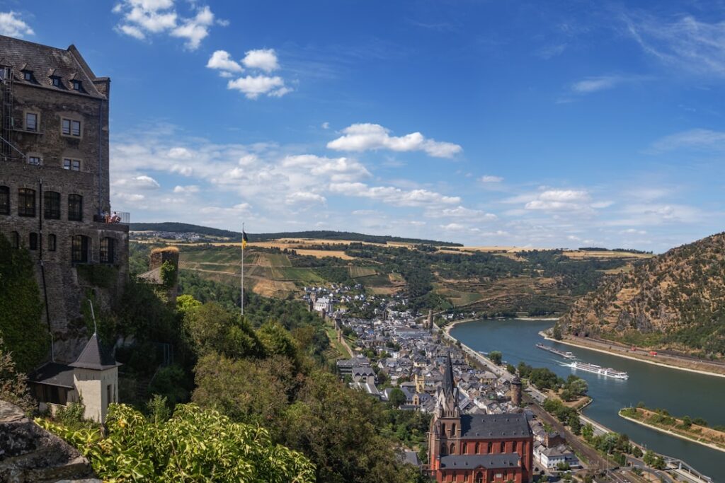 Castle overlooking the Rhine river and a historic town in Germany