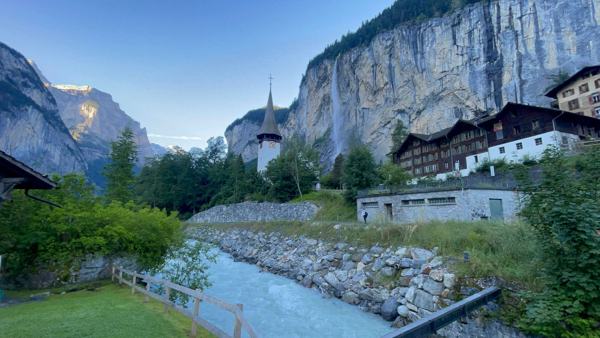 Alpine village beneath waterfall cliffs in the Lauterbrunnen valley, Switzerland