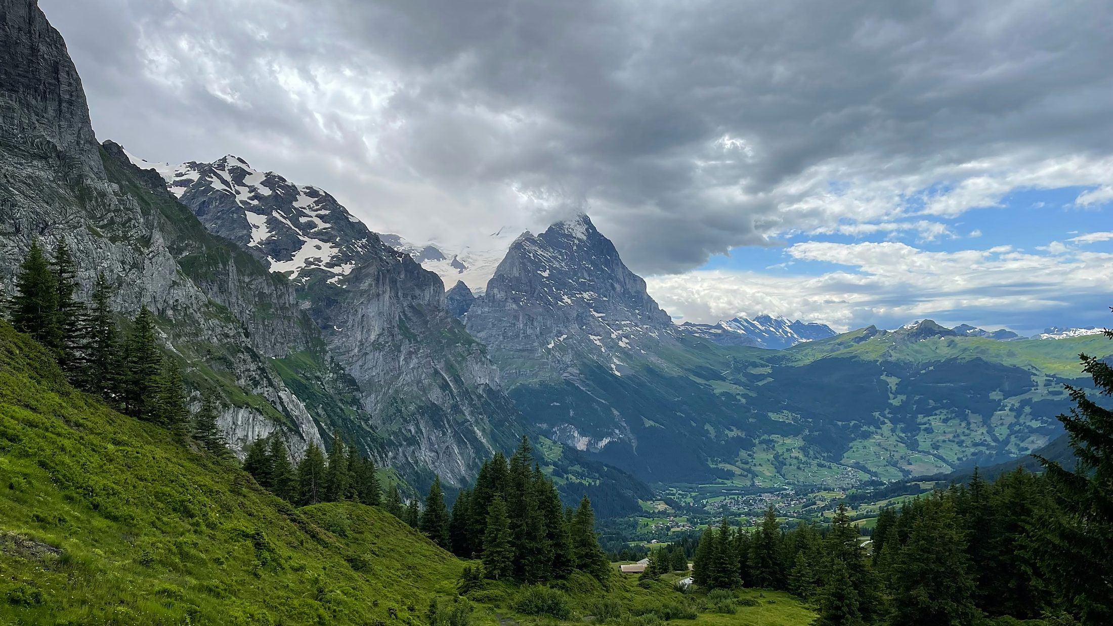 The Eiger north face above the green Grindelwald valley, Swiss Alps