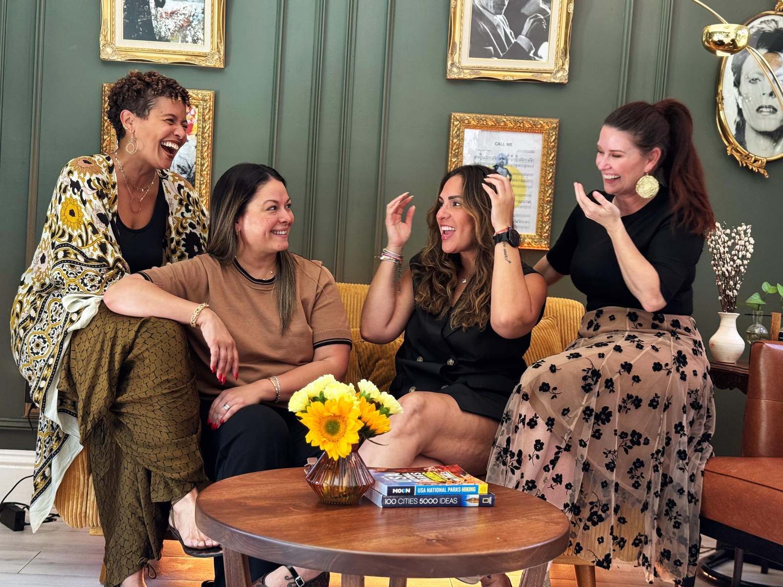 The Dorian Destinations travel advisor team laughing together in a candid studio photo