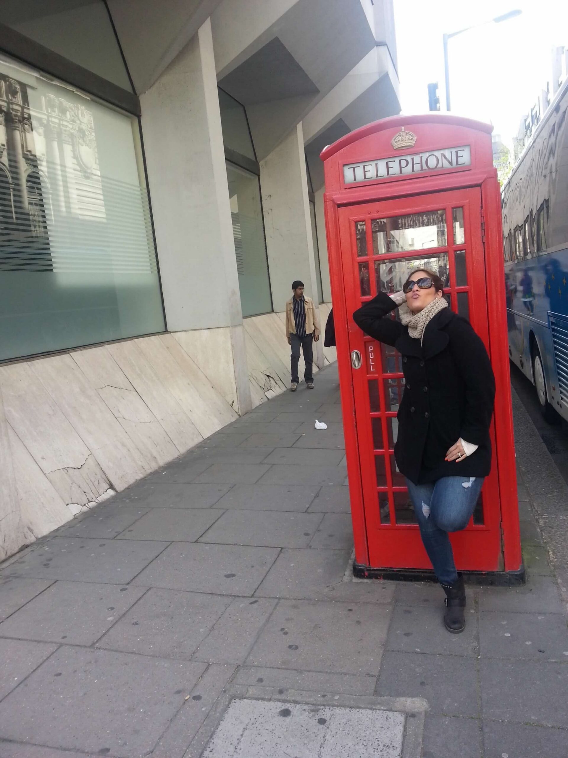 Barbie Villacis at a red telephone booth in London