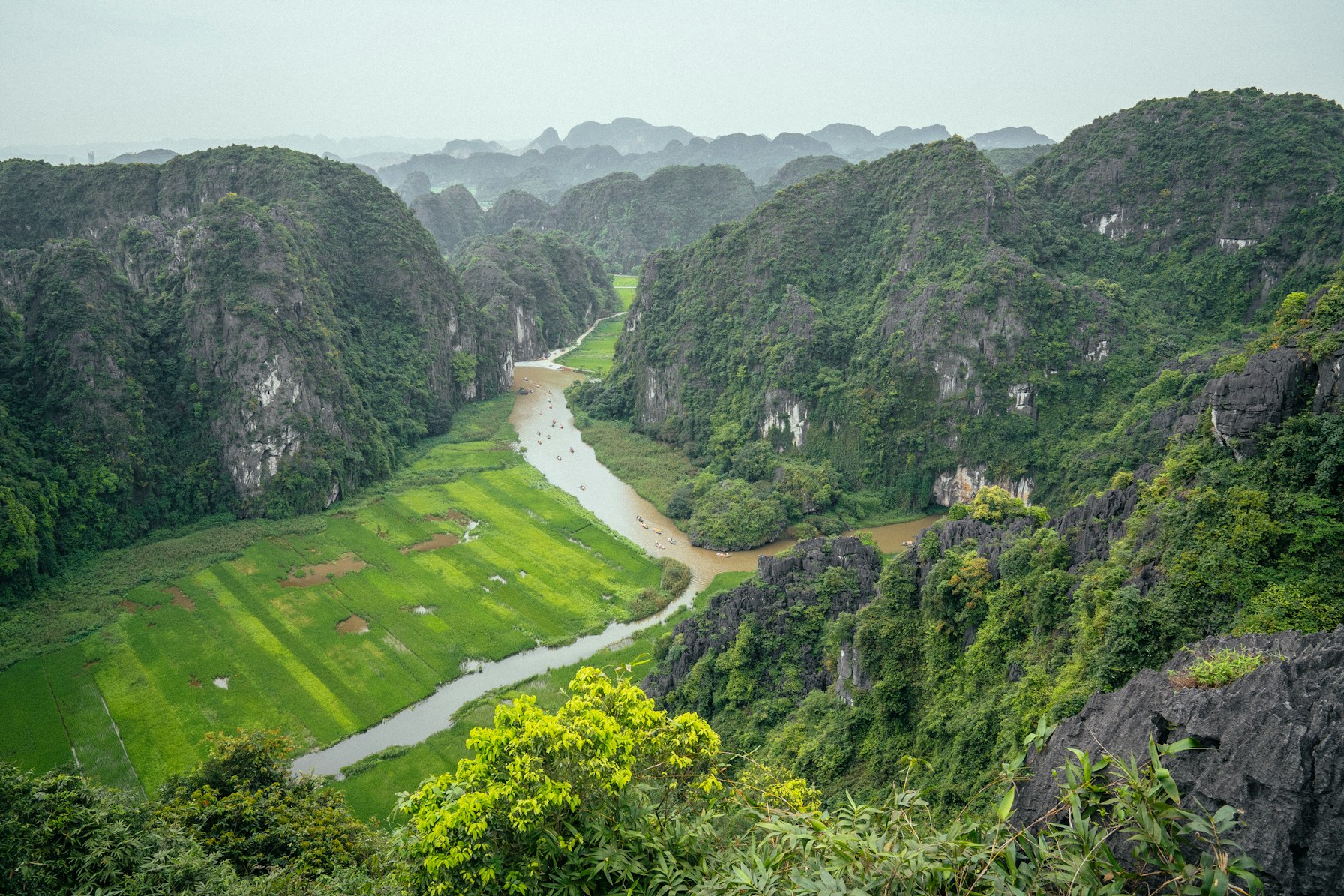 Vietnam Beyond Son Doong: A 7-Day Tu Lan Cave Expedition 1 Lush limestone valley and river near Phong Nha in central Vietnam
