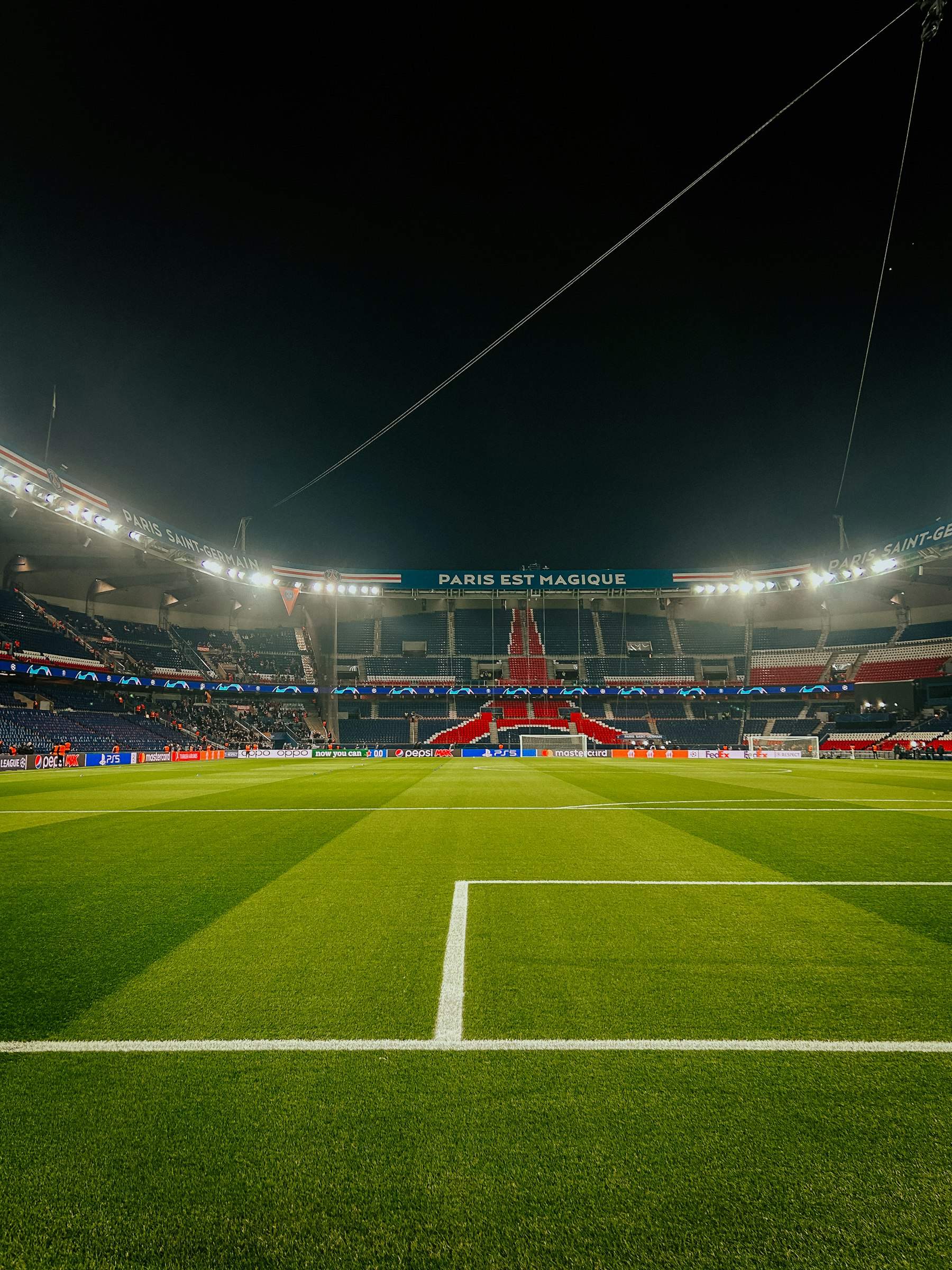 A floodlit European football stadium during a night match, the atmosphere awaiting the Champions League final 2027