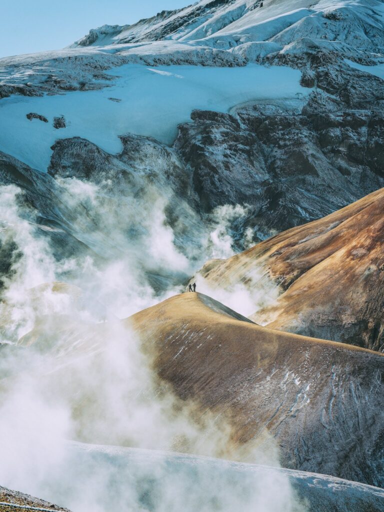 Hikers on a geothermal ridge in Kerlingarfjoll, Iceland Highlands