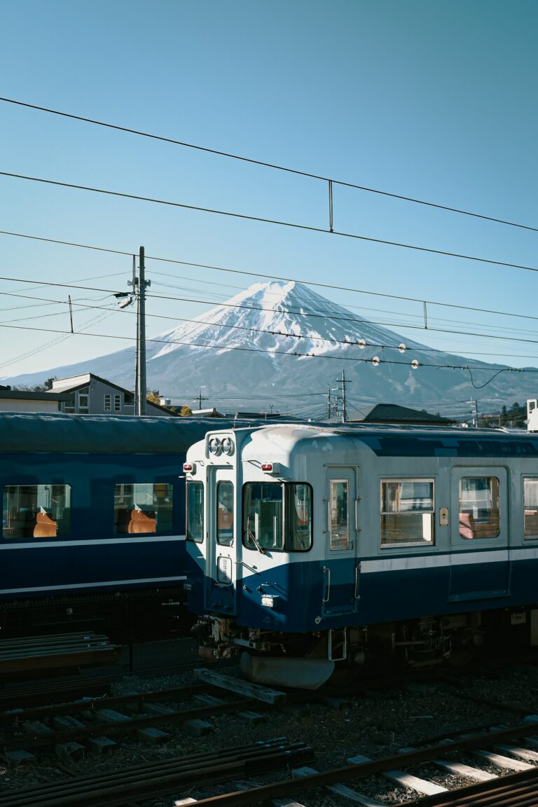 A shinkansen bullet train passing below Mount Fuji, the backbone of any Japan itinerary for 2 weeks