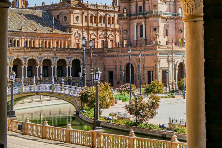 Plaza de España in Seville, with a bridge crossing its canal beneath the curved historic building