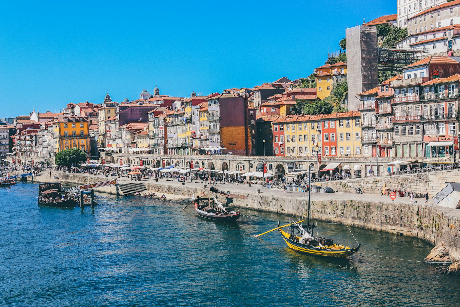 Traditional wooden boats moored on the Douro river at Porto, the final leg of this Spain and Portugal itinerary.