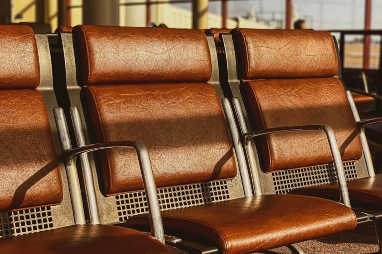 Warm brown seats in an airport departure lounge, illustrating this 24-hour cancellation rule guide