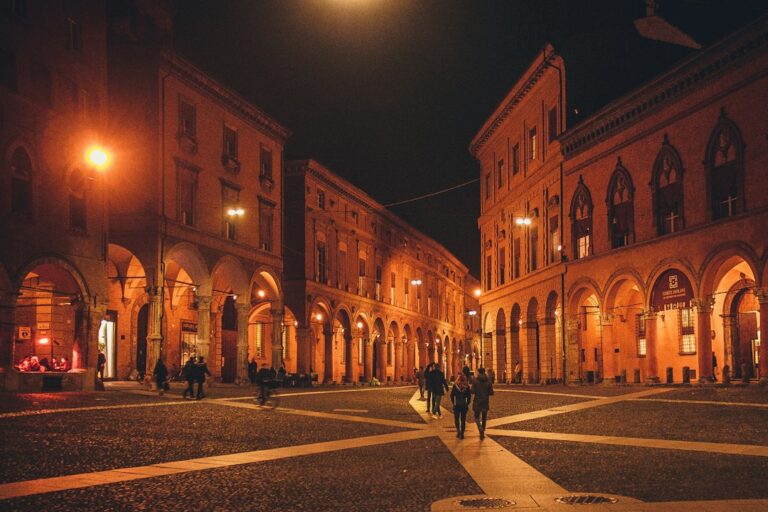 Bologna 3 day itinerary: evening light on the porticoes and cobblestones of Piazza Santo Stefano.
