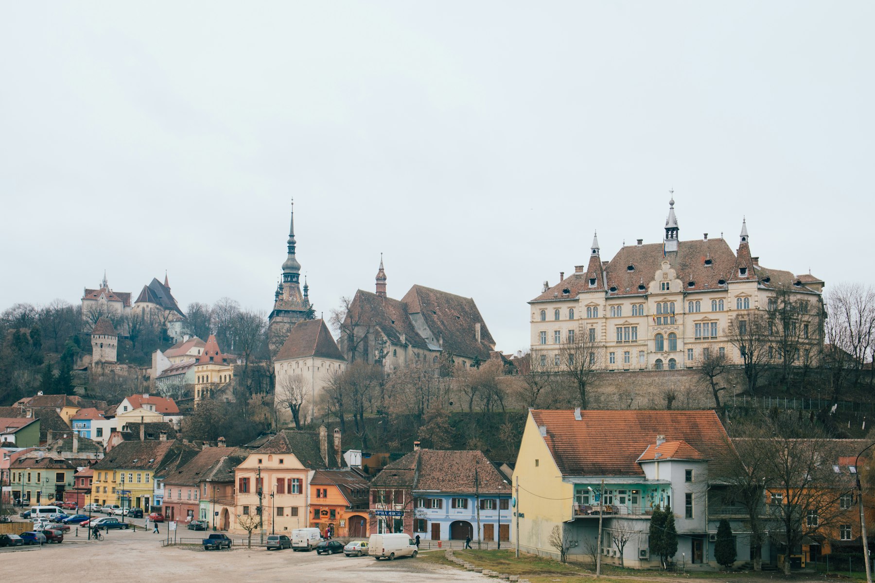 The citadel hill at Sighisoara rising above the lower town, the first anchor of a Romania itinerary built on inscribed sites