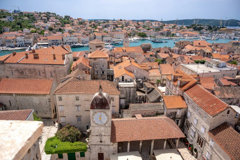 Things to do in Croatia: terracotta rooftops and the stone bell tower of Trogir&rsquo;s old town above its harbour